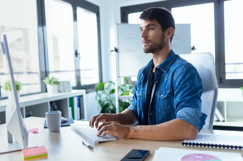 software developer working with computer in the modern startup office